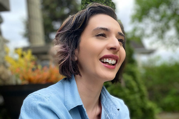 headshot of Linda Alvarez with trees in the background
