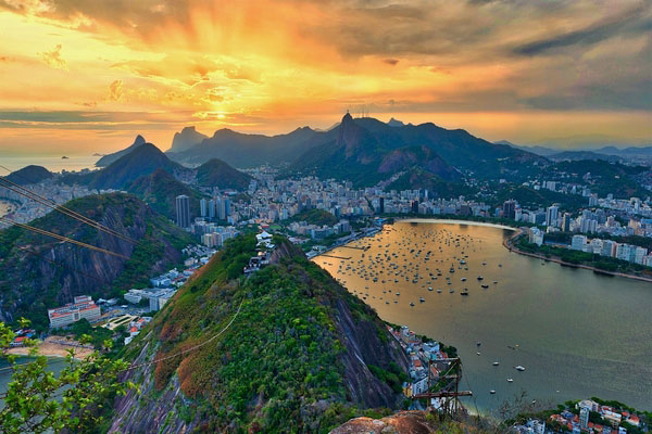 Aerial photo of the city of Rio de Janeiro, Brazil, with mountains and coastline in the distance