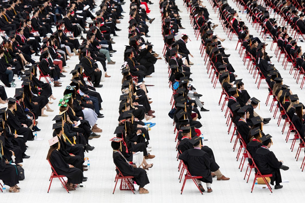 rows of graduates at commencement