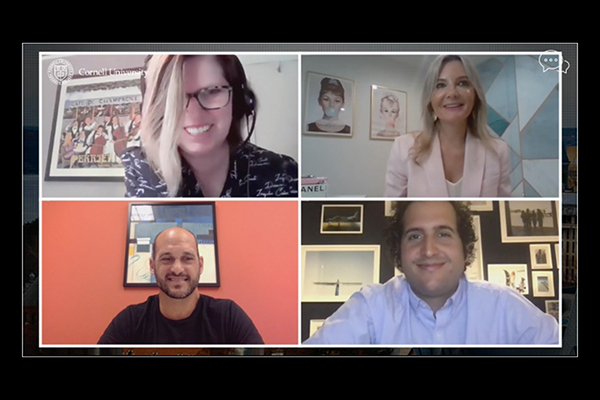 A screenshot, showing the four webinar panelists smiling during the online event.