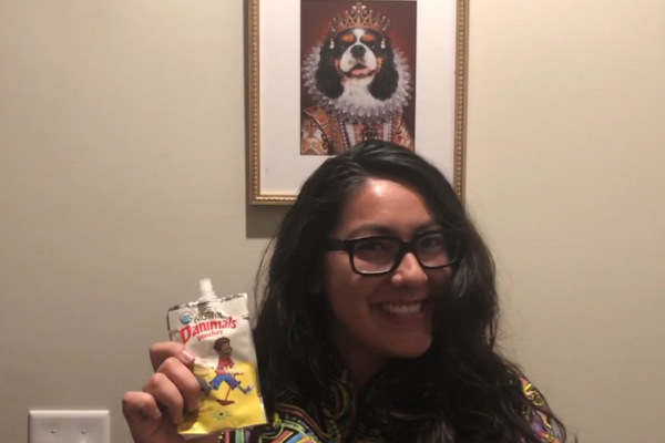 photo of Alanna Miyajima smiling and holding Danimals yogurt in her right hand