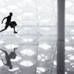 silhouette of man running with a brief case at airport