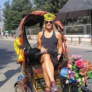 Anissa Buckley in a chariot on the streets of Kathmandu