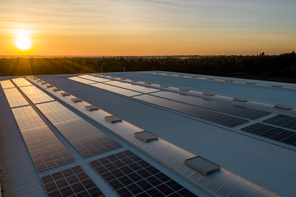 solar panel on top of a building during sunset