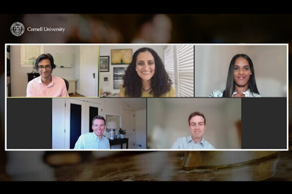 A screenshot, showing the five webinar panelists smiling during the online event.