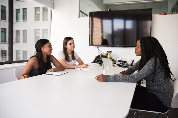 Business women meeting at a boardroom table