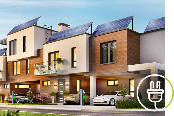 Modern apartment buildings with cars parked in front and charging at fast electric car charging stations