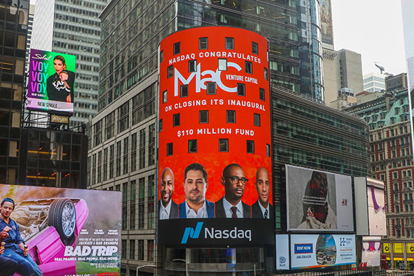 A 5-story-high Times Square marquis with photos of Marlon Nichols and his partners reads: “NASDAQ congratulates Mac Venture Capital on closing its inaugural $110 million fund”