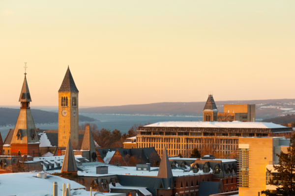 The sunrises over a snowy Ithaca campus.