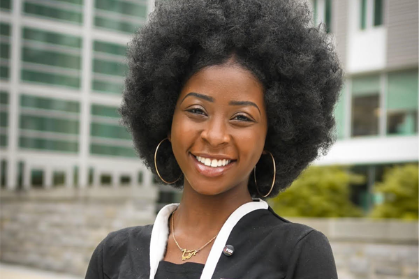 professional portrait of Rumbidzai Mangwende outside statler hall