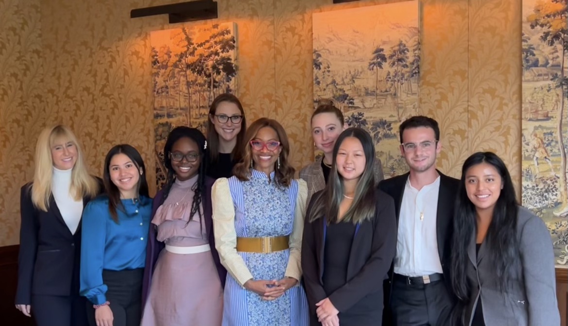 Students pose for a group photo with Yvette Thomas-Henry, regional vice president & general manager of Four Seasons Hotels and Resorts