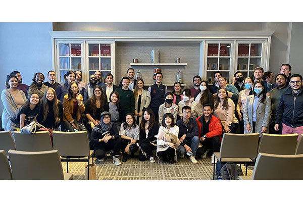 a group photo of about 40 young adults with some chairs in the foreground.