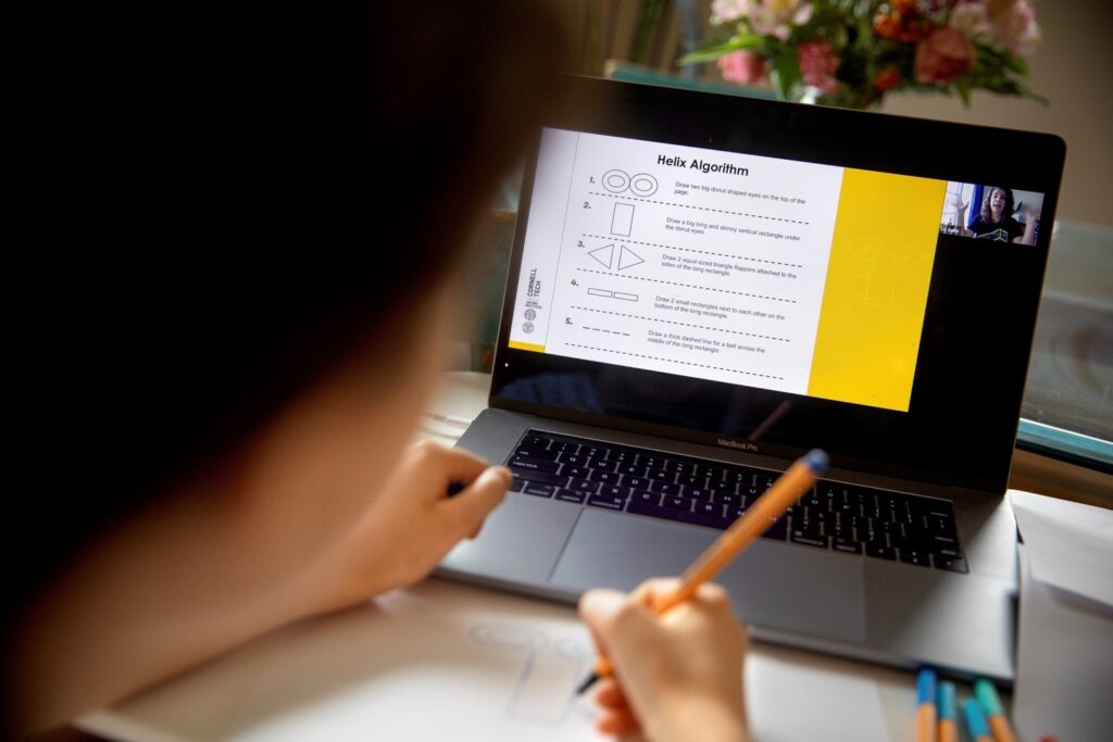 Online student learner taking notes