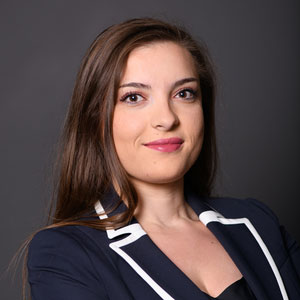 headshot of Ina Gjika.