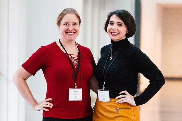 Stephanie Schrauth and Linda Alvarez pose side by side and smile for the camera.
