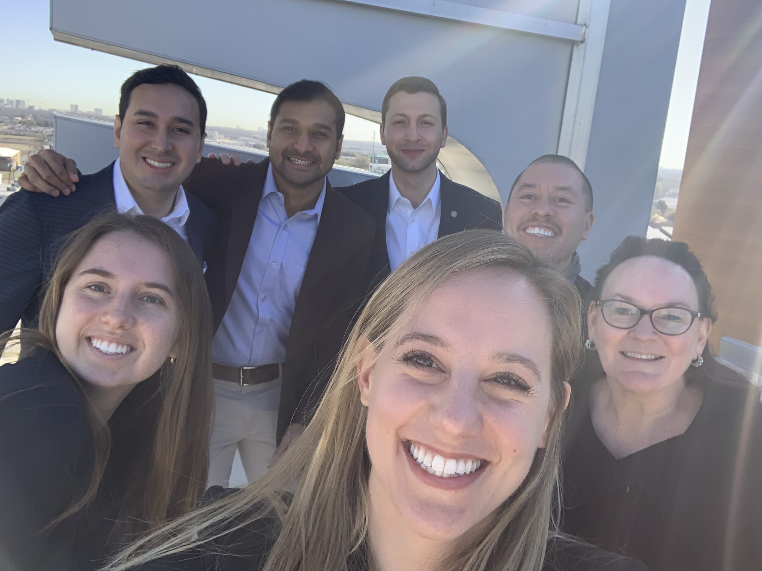 Clockwise from front: Students Annelie Miller ’23 (A&S), Kelly Moran, MMH ’22, Luis Nares Jaramillo, MBA ’23, Uddhav Prasad, MMH ’22, and Justin Finamore, MMH ’22, pose for a selfie with Jaime Maltos, the director of engineering for the Element Hotel Dallas Love Field, and Jeanne Varney at the conclusion of a site visit.