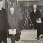 Alice Statler holds a shovel of dirt.
