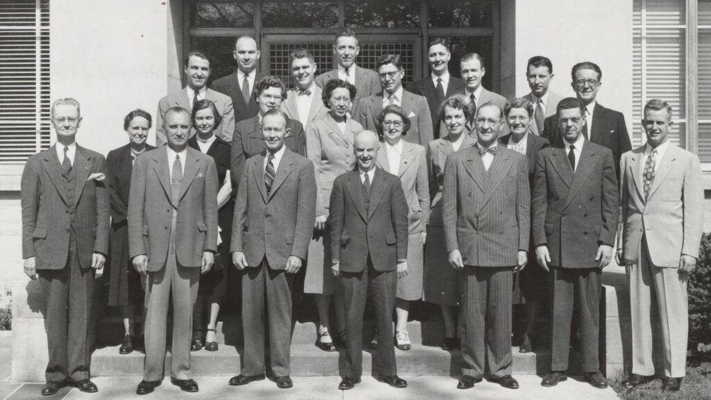 Meek and his faculty in 1952. He is flanked by long-serving professors Frank Randolph and John H. Sherry.