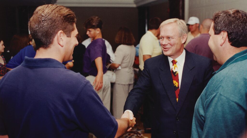 Dean David Dittman greets parents at a welcoming reception in the 1990s.