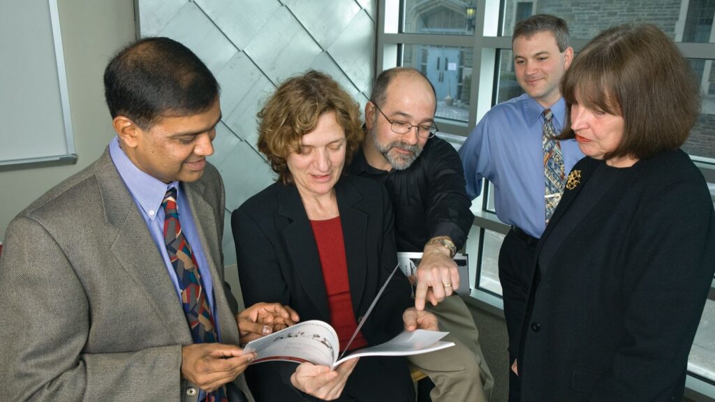 Former editors of Cornell Hospitality Quarterly in March 2007. From left: Rohit Verma, Linda Canina, Michael Lynn, Michael Sturman, and Daphne Jameson.