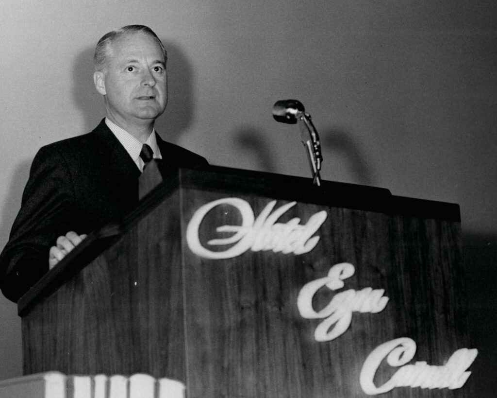 Joseph P. Binns ’28, vice president of Hilton Hotels and general manager of the Waldorf Astoria, speaks at HEC 30 in May 1955.