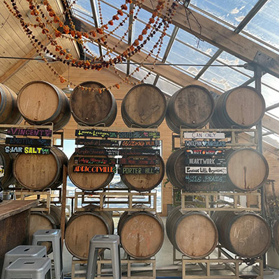 labeled wooden barrel kegs at Stone Bend Farm.