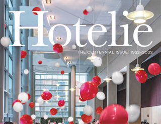 Hotelie Magazine cover image with balloons and a crowd in a lobby.
