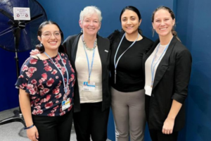 Courtney and three other delegates stand with Ko Barrett, Senior Advisor for Climate at the National Oceanic and Atmospheric Association for a group photo.