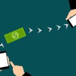 illustration of two mobile phones connected by arrows with a dollar bill between them.