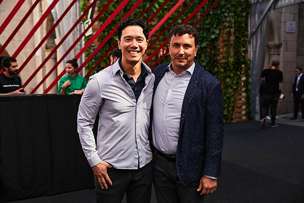 John Wu and Emin Gun Sirer standing side by side, smiling.