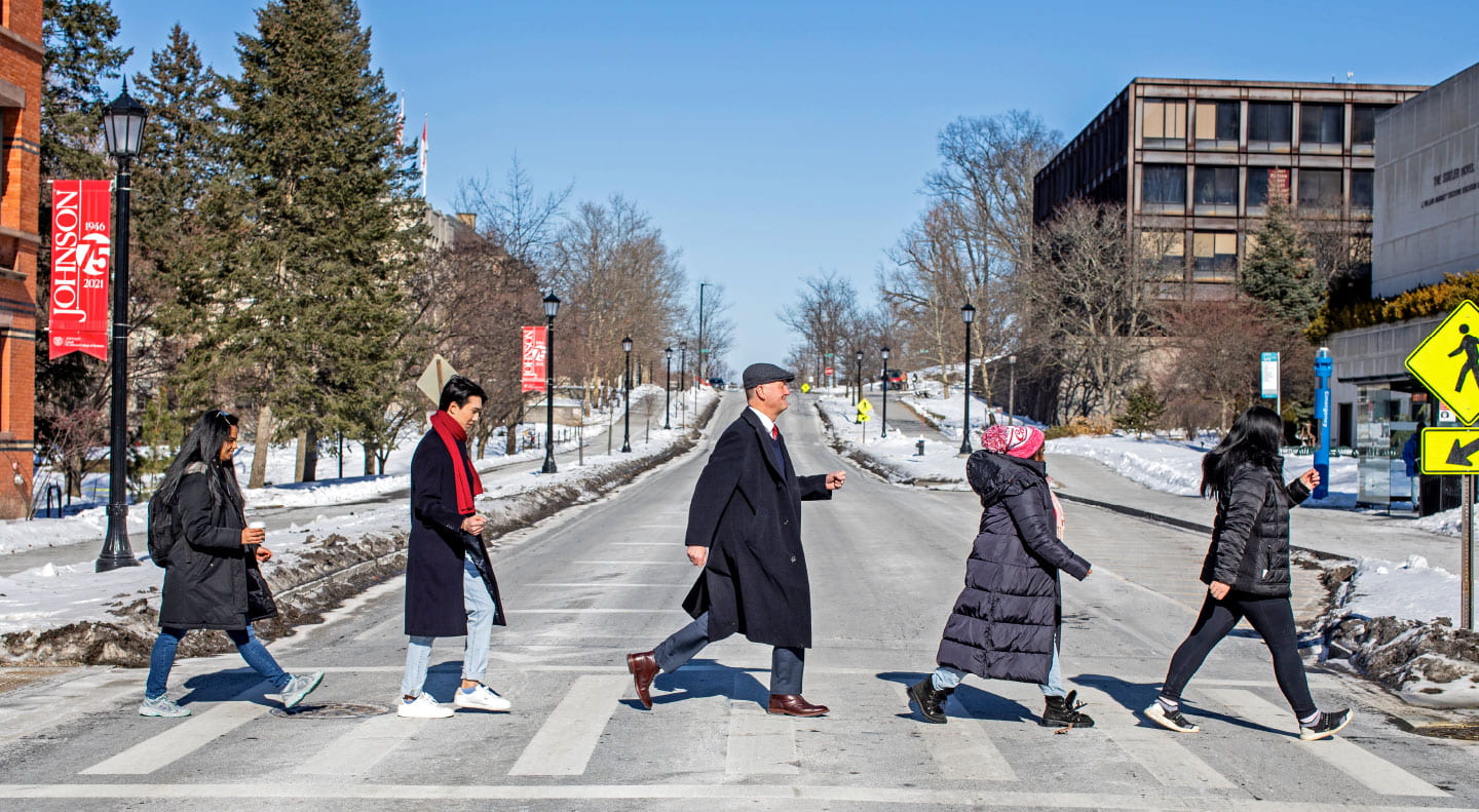 Dean Karolyi with four Cornell students posing as The Beatles Abbey Road album cover. 