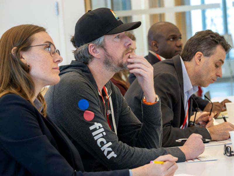 Image of several judges listening to presentations.