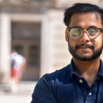 Image of Talha Islam ’24 in front of Warren Hall