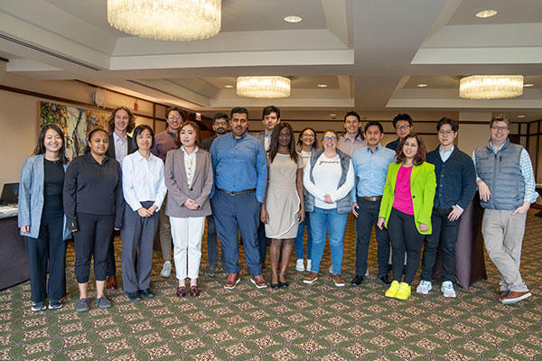 17 students and program director Gregory Ray pose for a group photo.