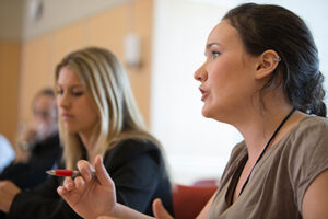 Student speaking at a labor relations roundtable