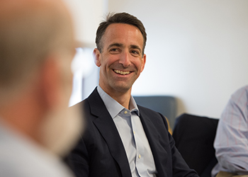 Businessman smiling in a meeting
