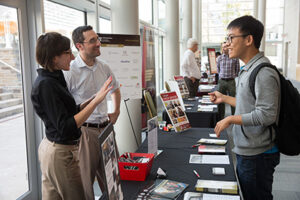 Student discussing the centers and institutes at the open house