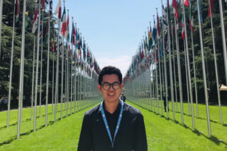 Feam Peeranut Supinanon (MBA '20)at the Allée des Nations, a park displaying the flags of all the member states of the United Nations