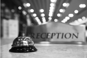 hotel reception desk with bell on it