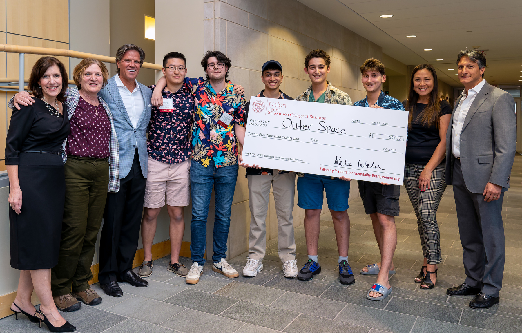 Dean Kate Walsh, Linda Canina along with two judges and the winning team