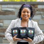 Martina Pablo Pablo in the Beck Center Atrium with the Mayan coffee she is roasting in Ithaca.
