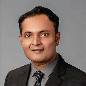 headshot of Guru Bhardwaj.