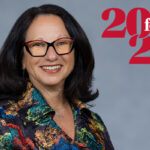 Headshot of Linda Giuliano with a 20 for 20 graphic identifier overlaid on the photo background.