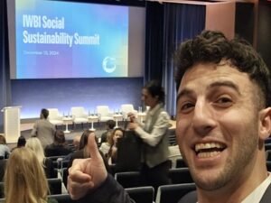 Jason Woolf taking a selfie in an auditorium.