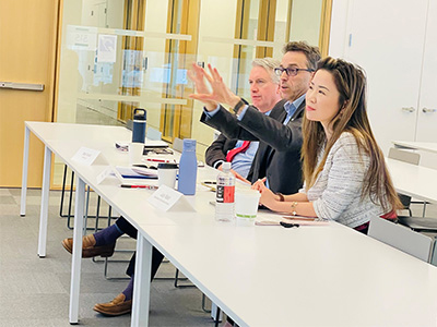 A panel of judges at a table