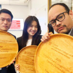 The Cornell team, composed of Prima Giovanni, MMH ’25, Harry Han, MMH ’25, and Ruby Lin, Kyoto MBA and MMH ’25, pose with their award plaques.