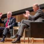 Image of Henry Kravis and Andrew Karolyi on stage during the lecture.