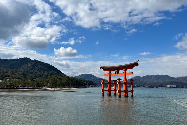 Image of the Itsukushima Shrine, a renowned Shinto landmark on the sacred island of Miyajima. The torii gate appears to be floating in the sea