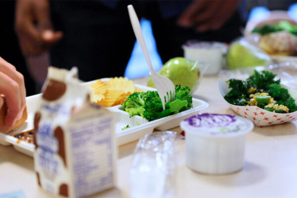 Image of students at City Honors School in Buffalo, New York, eat lunch on a “New York Thursday,” a weekly effort to promote the foods in the lunches that are grown or produced in New York State.