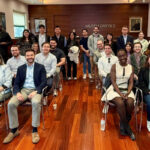 A group of people seated in a room.